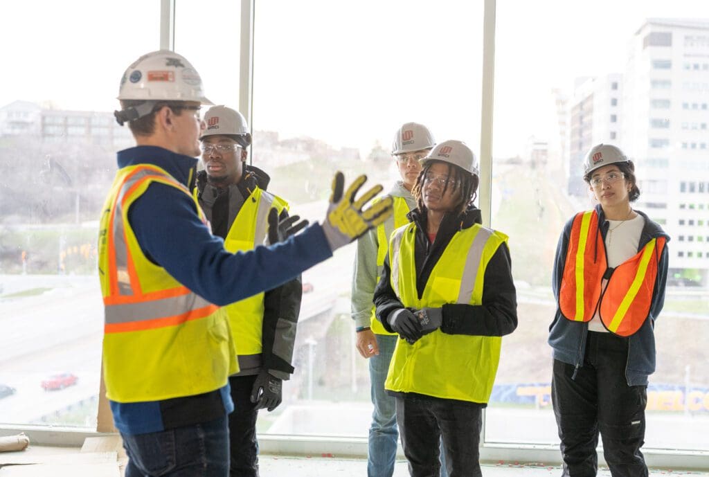 High School students on a field trip to a rockford construction job site.