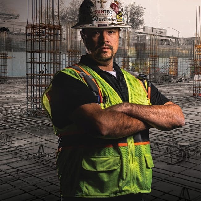 Photo of a concrete finisher standing in a job site - credit from byf.org