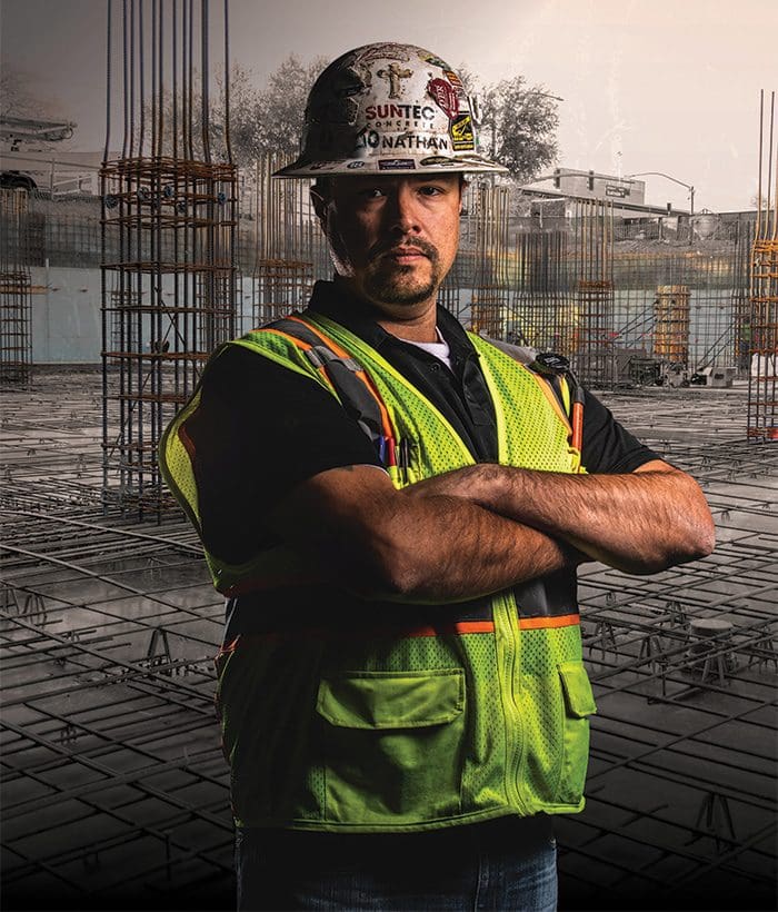 Photo of a concrete finisher standing in a job site - credit from byf.org