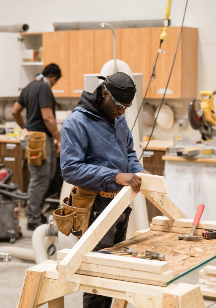 A West Michigan Construction Institute student learns a carpentry framing skill in WMCI's Carpentry 1 course.