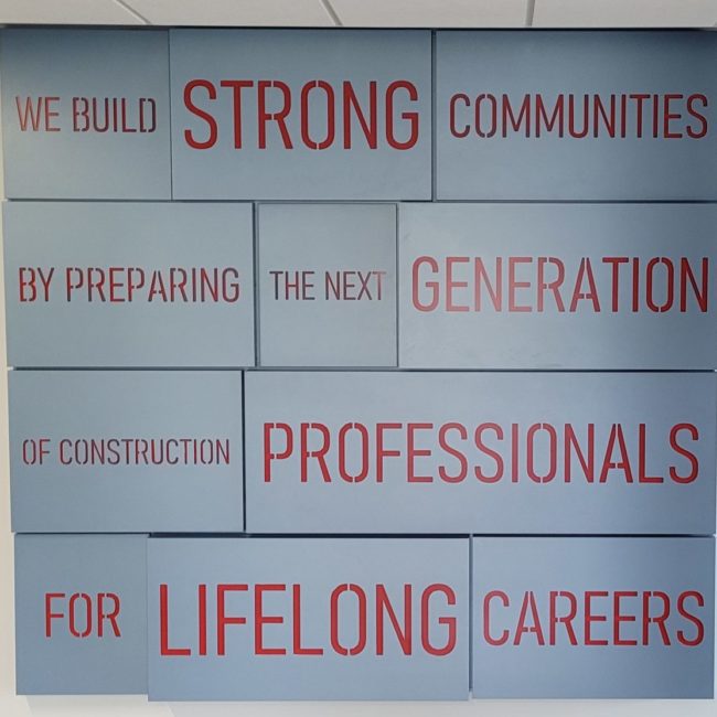 Photos of the WMCI values that are hung in the entry way to the institute