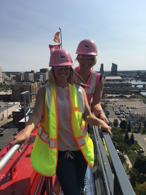 Jen Schottke and ABC coworker working on a crane on a jobsite.