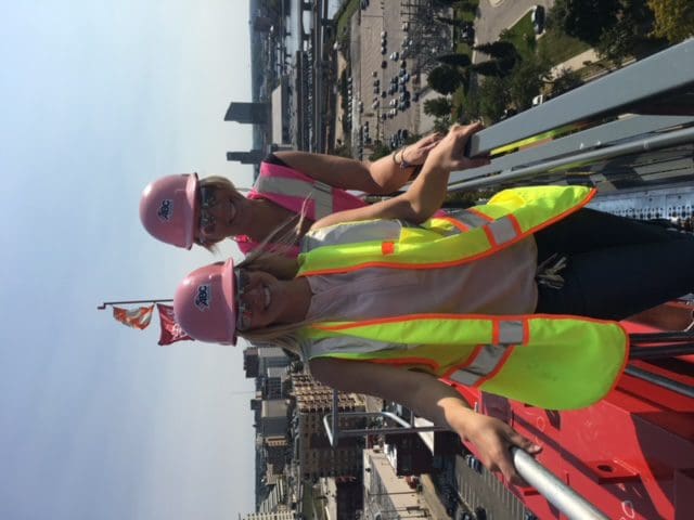 Jen Schottke and ABC coworker working on a crane on a jobsite.