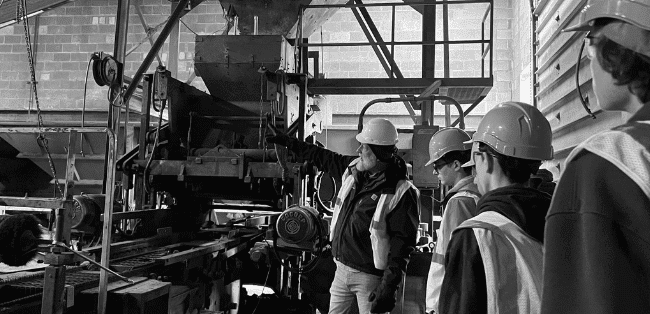 A WMCI instructor takes a group of high school construction students on a tour of a jobsite.