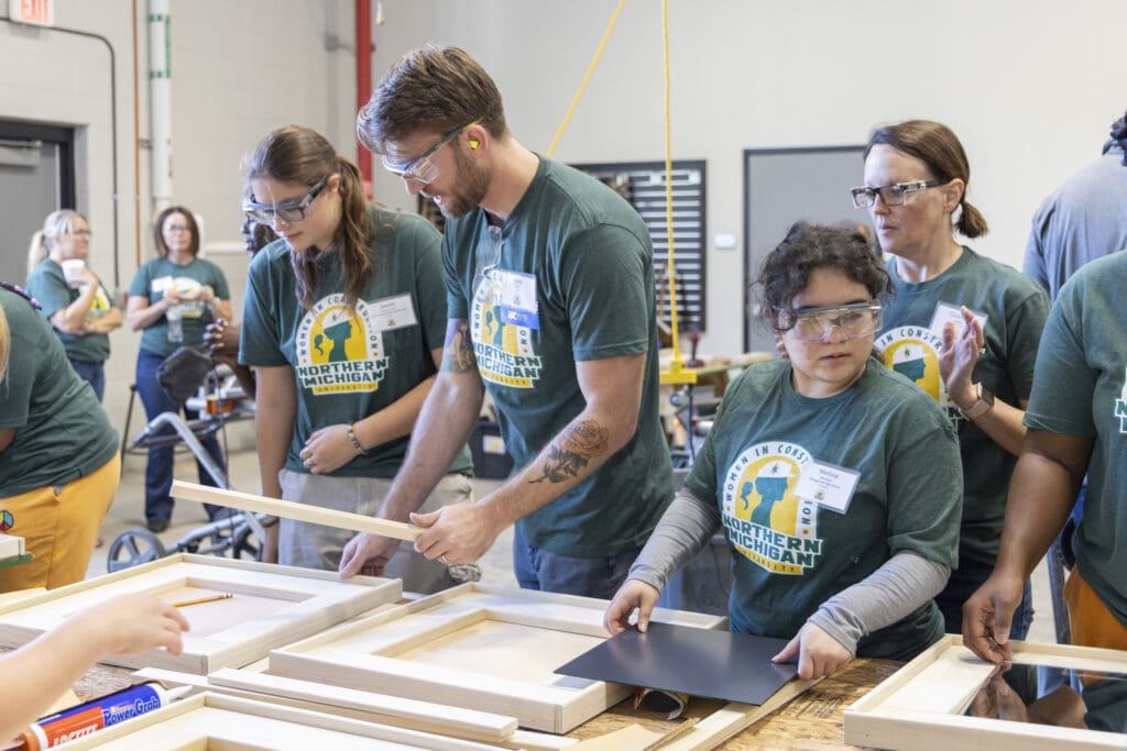 Kyle Jelens teaching a group of high school students commercial construction carpentry skills