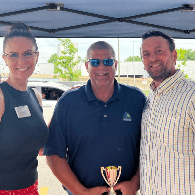 Clark Causely receiving an award for WMCI instructing from Jen Schottke (President of West Michigan Construction Institute) and Jason Roh (Director of education.)
