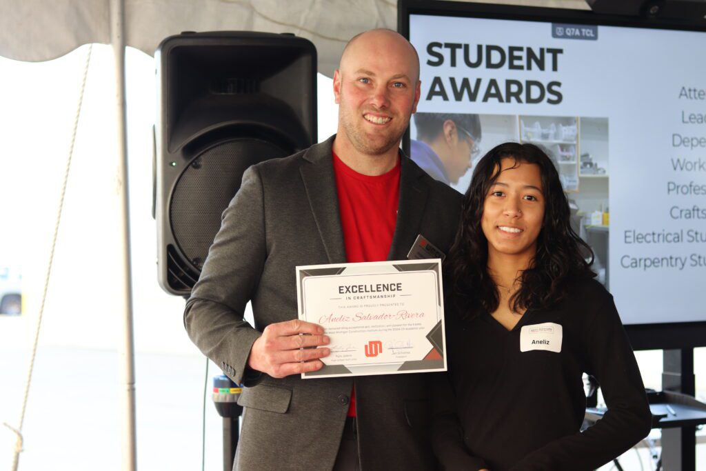 A WMCI student celebrates her graduation with the WMCI high school instructor.